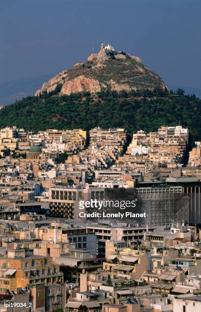 lykavittos hill and buildings, athens, greece - zentralgriechenland stock-fotos und bilder