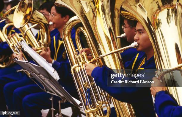 band of tuba musicians, macau, china, north-east asia - north east china stock pictures, royalty-free photos & images