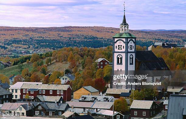 church tower above town buildings, roros, sor-trondelag, norway, europe - roros mining city stock pictures, royalty-free photos & images