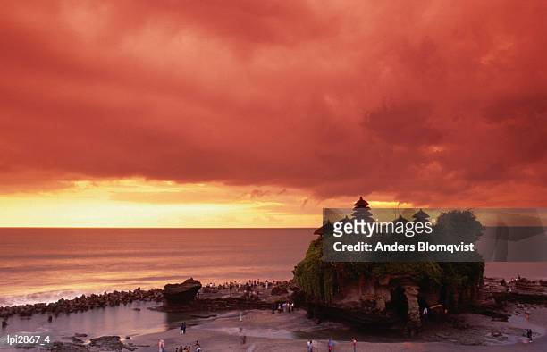tanah lot, sea temple, at sunset, bali, indonesia, south-east asia - beachcombing stock pictures, royalty-free photos & images