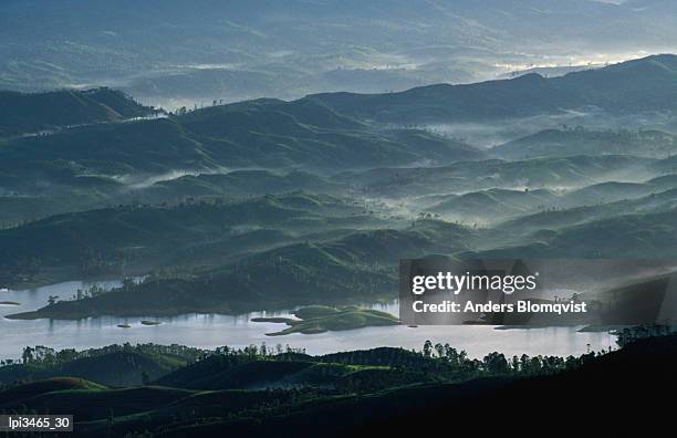 low lying hills and waterways from adam's peak, central, sri lanka, indian sub-continent - general economy as central bank of sri lanka looks to contain rising inflation stockfoto's en -beelden