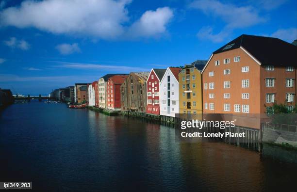nidelva river and warehouses. - trøndelag stock pictures, royalty-free photos & images