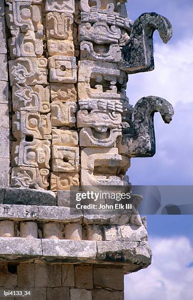 chac masks carved in stone on exterior walls of temple in the nunnery quadrangle (cuadrangulo de las monjas), uxmal, mexico - uxmal fotografías e imágenes de stock