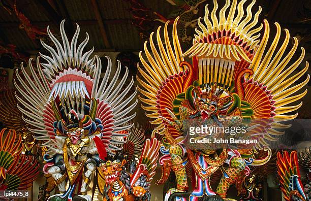 detail of traditional wood carvings, front view, ubud, indonesia - john wood fotografías e imágenes de stock