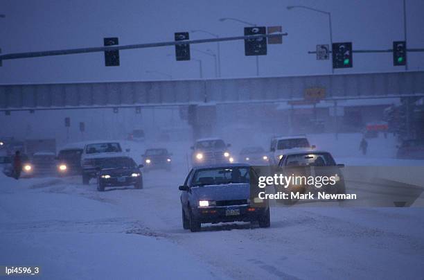 traffic driving through snow storm, anchorage, united states of america - south central alaska stock pictures, royalty-free photos & images