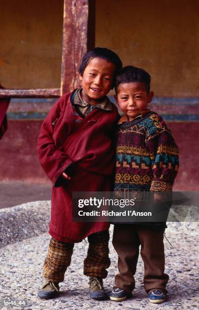 two young tibetan boys at drepung monastery, lhasa, tibet, china, north-east asia - tibet autonomous region stock pictures, royalty-free photos & images