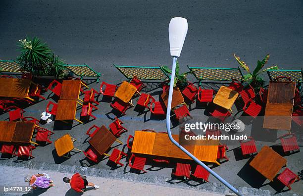 outdoor cafe chairs and tables, giardini-naxos, sicily, italy, europe - giardini naxos stock pictures, royalty-free photos & images