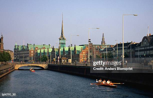 fredriksholm canal with the borsen building (stockmarket) in background, copenhagen, denmark, europe - slotsholmen stock pictures, royalty-free photos & images