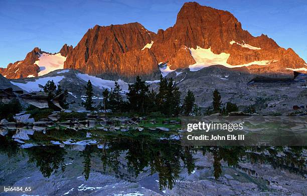 banner peak with lake garnet reflecting the trees and rocky water edge, ansel adams wilderness area, united states of america - ansel stock pictures, royalty-free photos & images