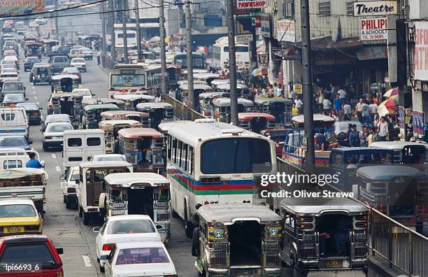 traffic in inner city, manila, philippines - フィリピン ストックフォトと画像