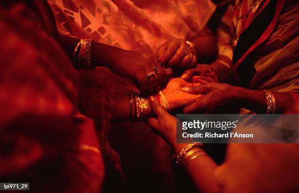 hand of bride being held by female relatives during wedding ceremony, india, indian sub-continent - indian subcontinent ethnicity bildbanksfoton och bilder