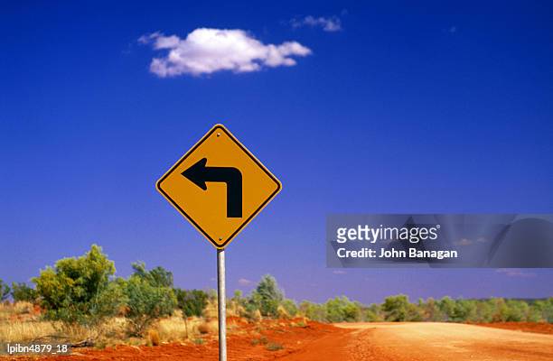 road sign pointing to rainbow valley road, rainbow valley conservation reserve, northern territory, australia, australasia - banagan stock pictures, royalty-free photos & images
