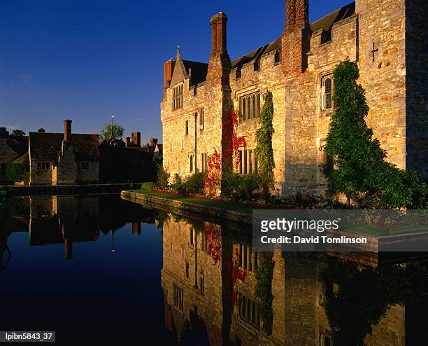 hever castle reflected in moat in autumn., kent, united kingdom, england, europe - hever castle stock pictures, royalty-free photos & images