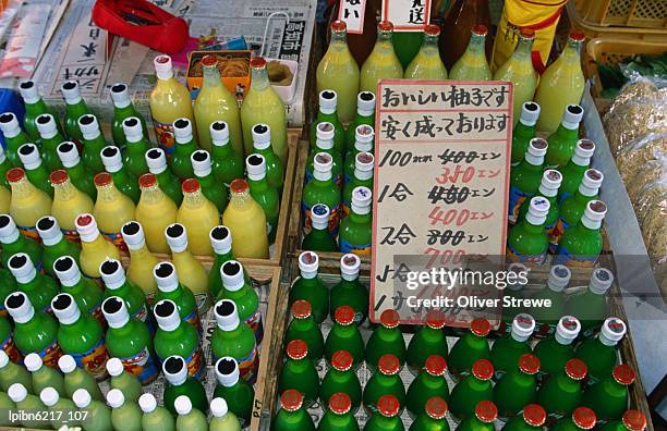 bottles of drink for sale at the asa-ichi or morning market., kochi, shikoku, japan, north-east asia - for sale korte frase stockfoto's en -beelden