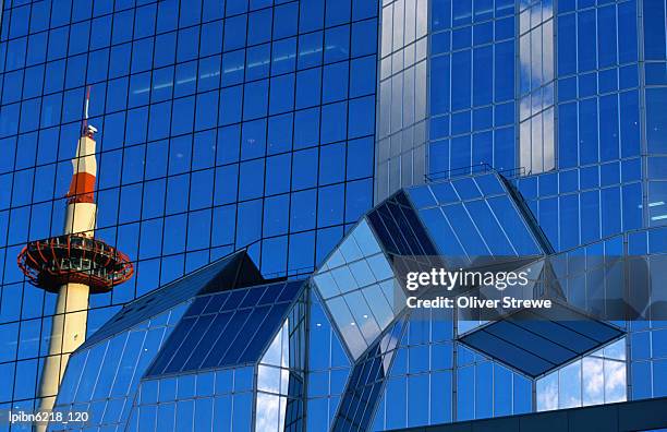 kyoto tower reflected in glass walls of kyoto station., kyoto, kinki, japan, north-east asia - kyoto station stock pictures, royalty-free photos & images