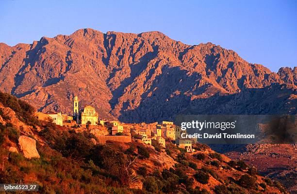 hilltop village bathed in afternoon sunlight., corsica, france, europe - balagne stock pictures, royalty-free photos & images