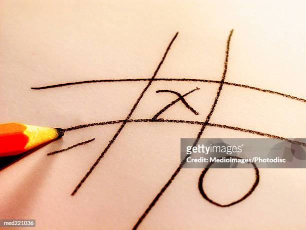 close-up of a pencil playing knots and crosses - intersected stock pictures, royalty-free photos & images