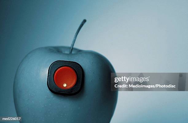 apple with a button - religiöses ereignis stock-fotos und bilder