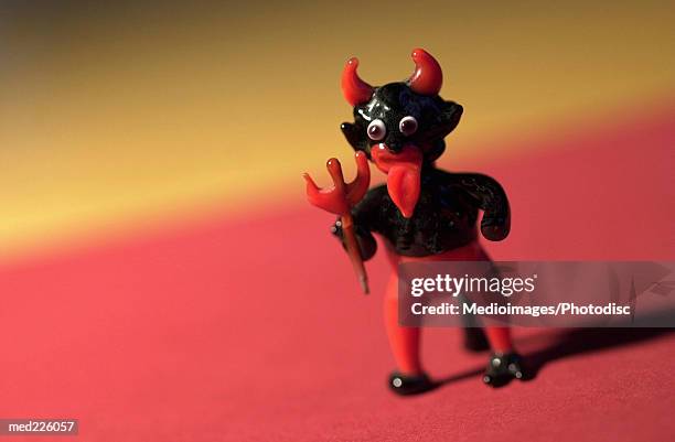 miniature figure of the devil - religiöses ereignis stock-fotos und bilder