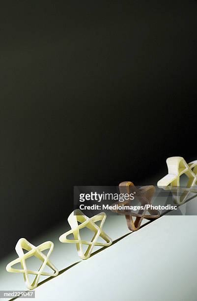star shaped pasta - intersected stock pictures, royalty-free photos & images