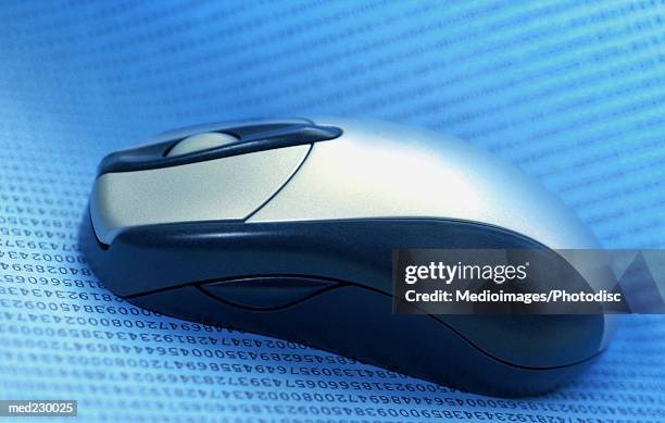 close-up of a cordless mouse on paper - cordless device stock pictures, royalty-free photos & images