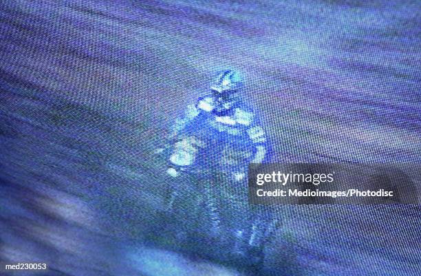 figure of a man riding a motorbike - pan stock-fotos und bilder