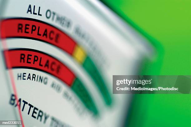 close-up of a battery meter - probador de pilas fotografías e imágenes de stock