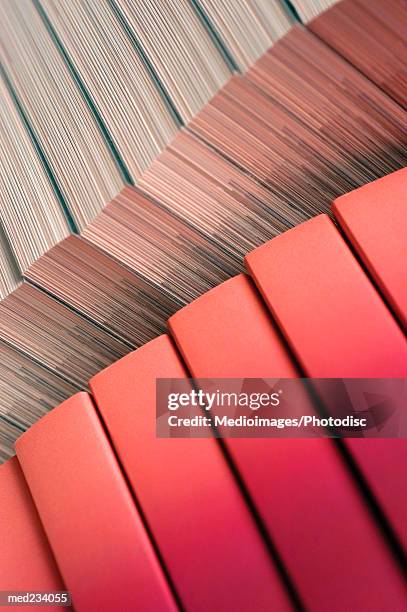 close-up of an array of books - literature rack stock pictures, royalty-free photos & images