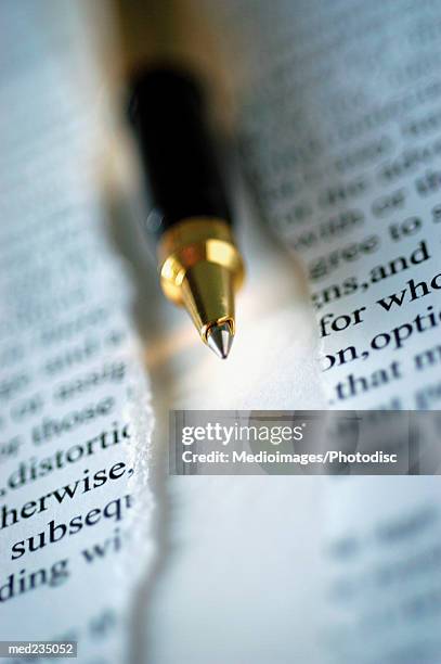 ball point pen on a sheet of torn paper - torn contract stock pictures, royalty-free photos & images