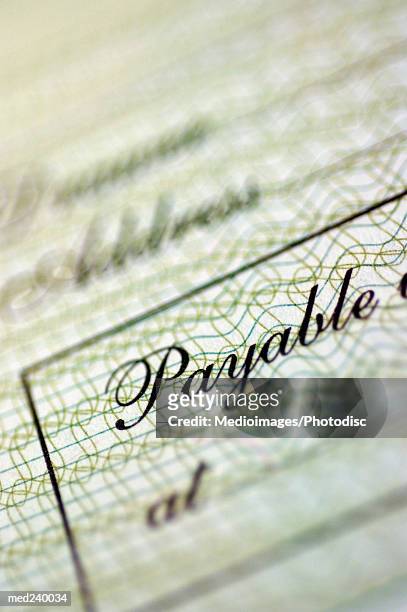 close-up of a bank check - intersected stock pictures, royalty-free photos & images