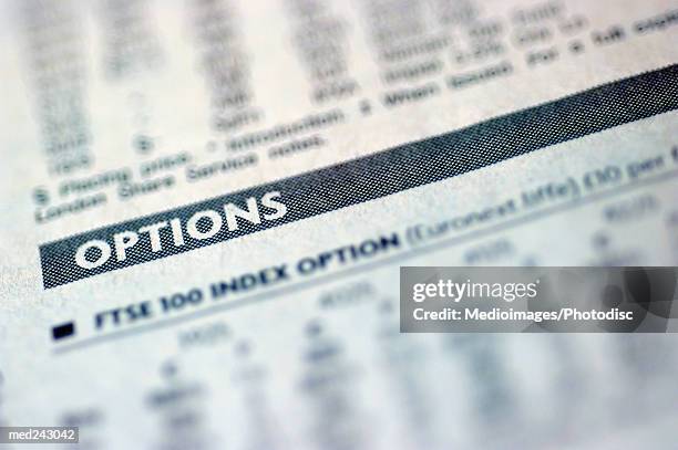 newspaper opened to the financial page, extreme close-up - share prices of consumer companies pushes dow jones industrials average sharply higher stockfoto's en -beelden