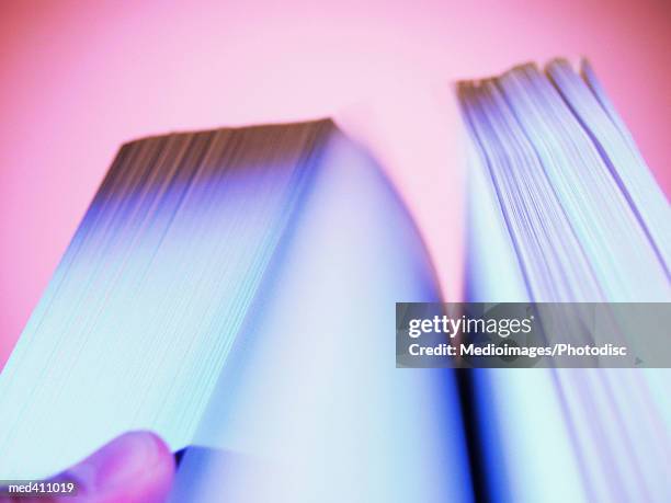 human hand flipping pages of a book - pages of president george washingtons first inaugural address on in u s capitol building stockfoto's en -beelden