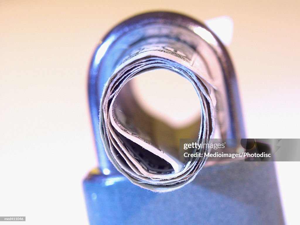 Roled Note Closeup Of A Rolled Bank Note In A Pad Lock High-Res Stock Photo ...