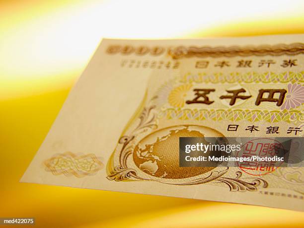 close-up of a japanese bank note - five thousand yen note stock pictures, royalty-free photos & images