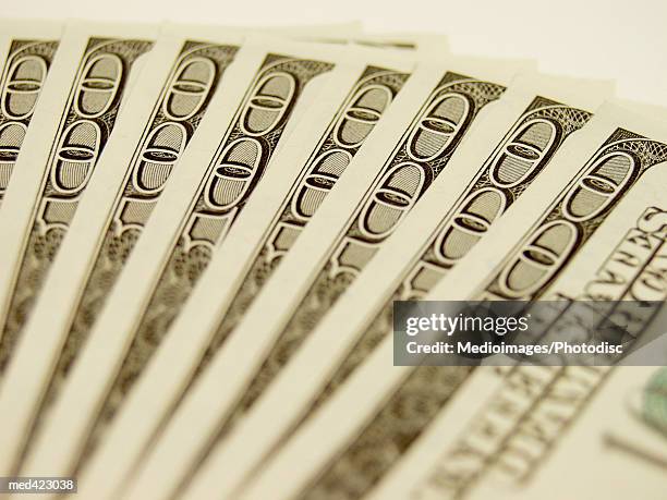 an array of american bank notes - fan shape stock pictures, royalty-free photos & images