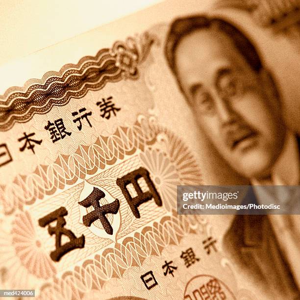 close-up of a japanese bank note - five thousand yen note stock pictures, royalty-free photos & images