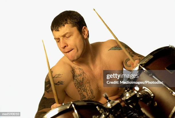 man playing the drums - modern rock stock pictures, royalty-free photos & images