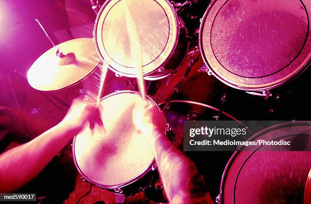 man playing the drums - modern rock stock pictures, royalty-free photos & images