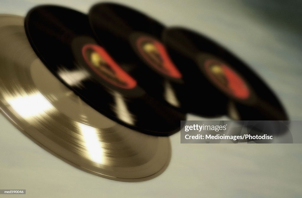 Three vinyl records and one CD