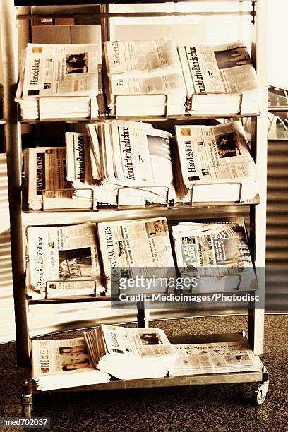 international newspapers on rack, close-up, part of - banca de jornais imagens e fotografias de stock