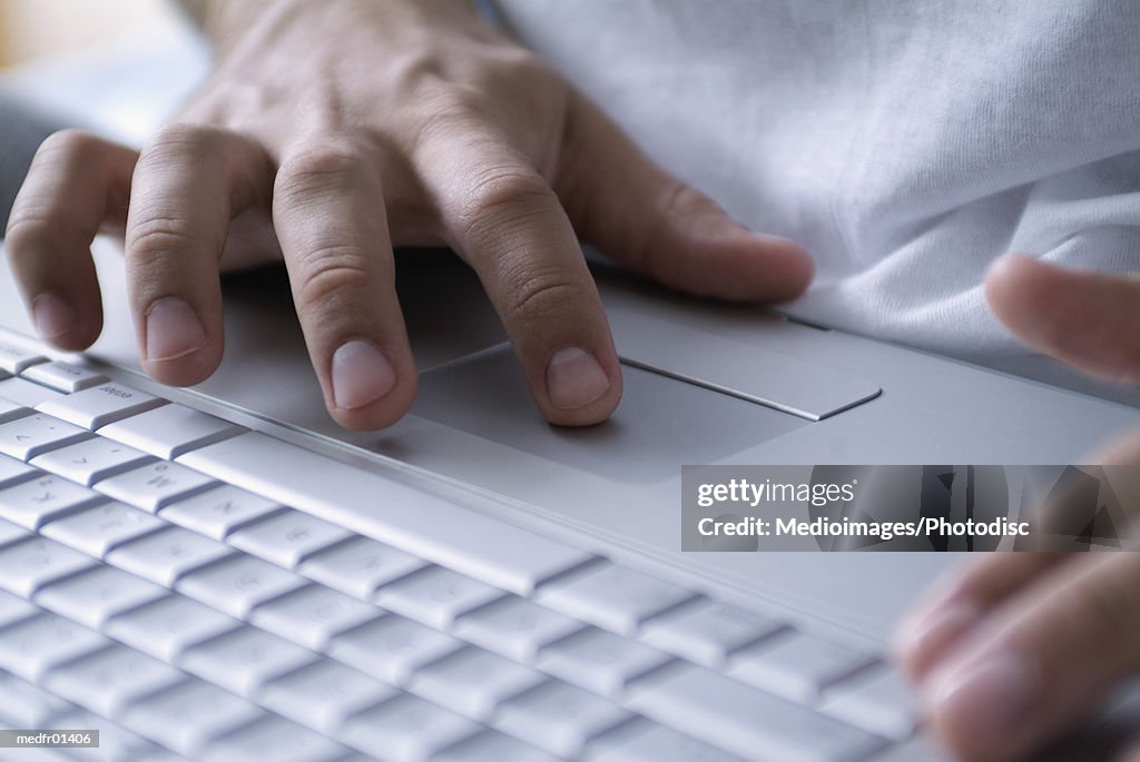 Human Hands operating a Laptop