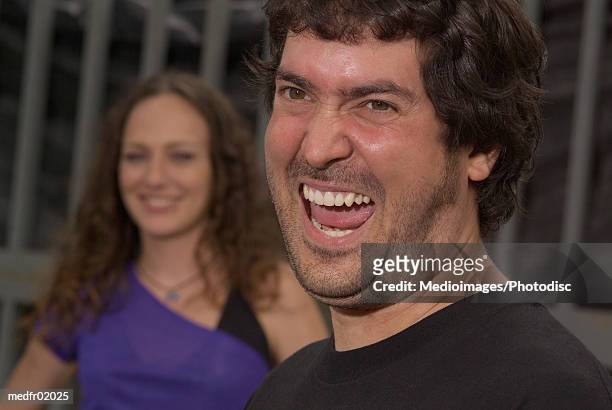 close-up of a man laughing - peinado ondulado fotografías e imágenes de stock