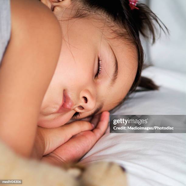 three year old girl sleeping, close-up - year on year stock pictures, royalty-free photos & images