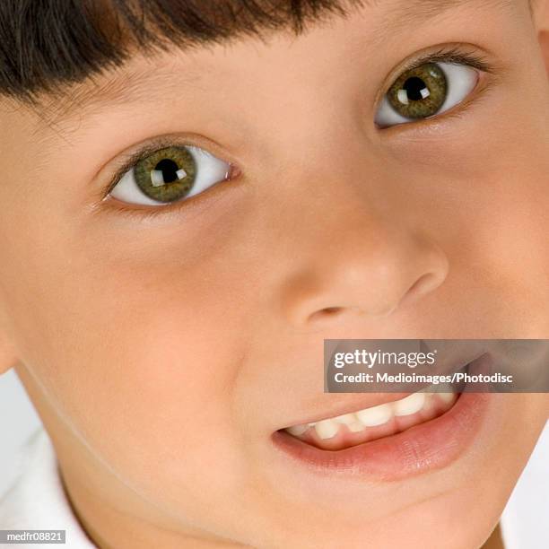 extreme close-up of six year old boy's face - year on year stock pictures, royalty-free photos & images