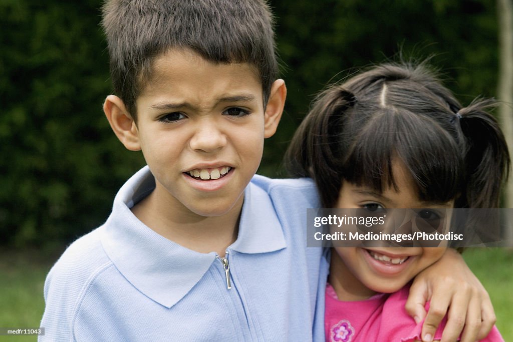 Portrait of young boy and young girl, close-up