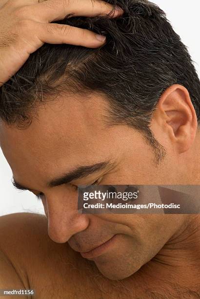 side profile of a man with his hand on his head - hand on head ストックフォトと画像