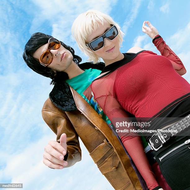 young goth couple standing outdoors, close-up, tilt - body modification stock-fotos und bilder