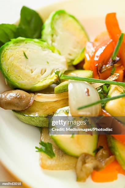 plate of cooked mixed vegetables, extreme close-up, part of, selective focus - orange bell pepper stock pictures, royalty-free photos & images