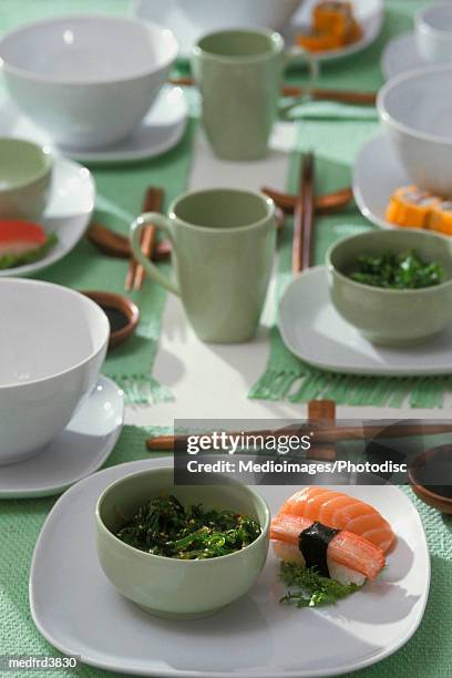 japanese place settings with sushi and cooked greens - only japanese ストックフォトと画像