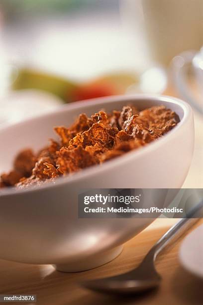 bowl of cereal with spoon and part of sugar bowl, close-up, tilt - sugar bowl crockery stock pictures, royalty-free photos & images